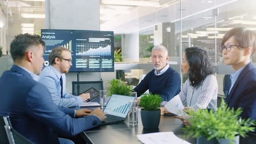 Diverse Group Collaborates in Modern Office Meeting