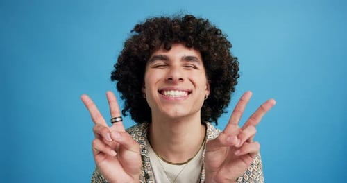 Fashion, peace sign and face of man in studio for confidence, trendy style and cool clothes