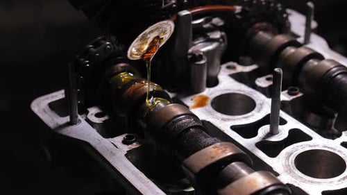 Engine Close Up with Pouring Motor Oil