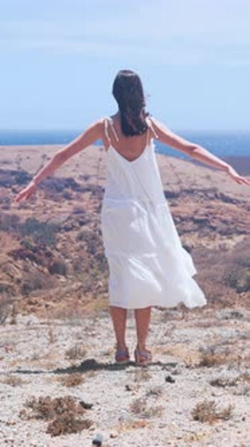 Seaside Freedom Dance Jacqueline Overlooking Vast Ocean in Her Flowing White Dress Expresses