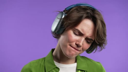 Young Adult Enjoys Music with Headphones