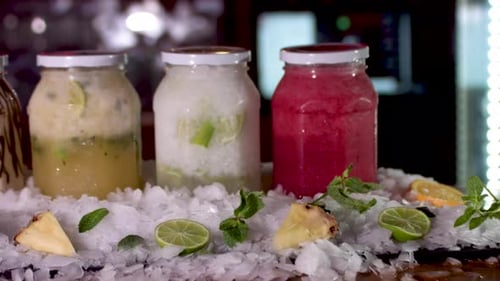 Colourful Frozen Smoothie Jars On Bar. Dolly Forward, dolly left