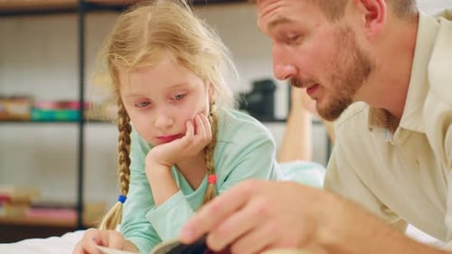 Caucasian father spend leisure time with baby gir in bedroom at house. Happy family, Loving parent t