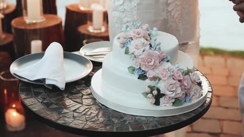 Wedding Cake with Flowers on Decorative Table