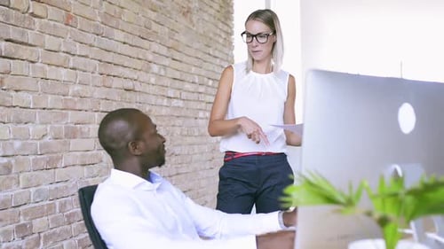 Two Business People in the Office Working Together
