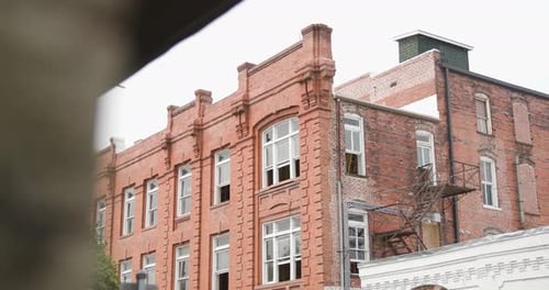 Revealing shot of vintage abandoned building during a overcast day