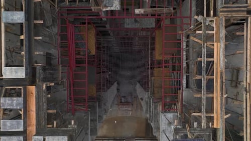 Aerial Video of Tower Crane Assisting on Housing Framework