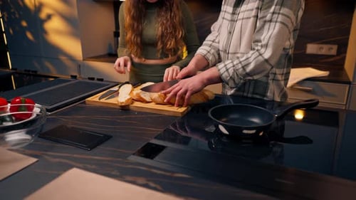 Close Up Young Couple in Love in a Beautiful Kitchen Preparing Dinner Together Happy Relationship