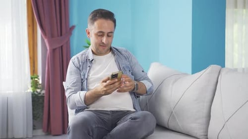 The man who happily puts the phone to his heart.