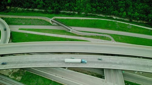 Semi-trailer Truck And Cars Driving On Multiple Lanes Of Interstate 90 In Minnesota, USA. aerial top