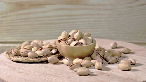 Bowl of Pistachios on Wooden Plate