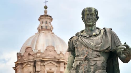 Statue of Julius Caesaer located in the centre of Rome, Italy. Buildings on the background