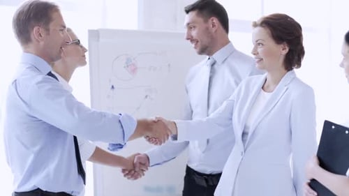 Business Team Collaboration in Office Shaking Hands