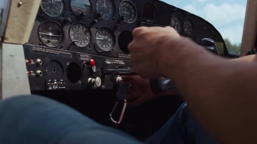 Aviator Hands Ready Piloting Airplane in Technological Aircraft Cabin Closeup
