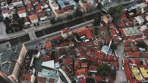 A top down drone shot from Baščaršija. the old center of Sarajevo. The big building where the drone