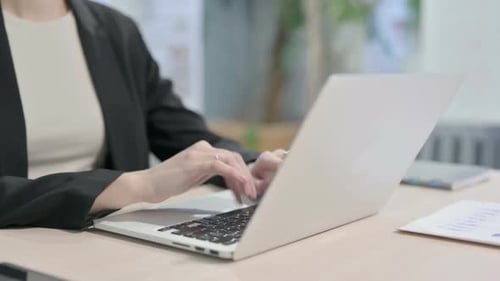 Close up of Businesswoman Typing on Laptop