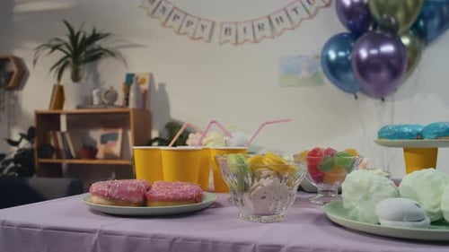 Festive Birthday Party Table with Colorful Sweets