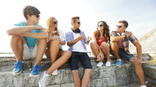 Summer Vacation, Friendship, Street Life, Technology And People Concept - Group Of Smiling Teenag...