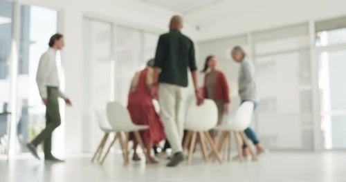 Blurred Group Meeting in a Bright Modern Office