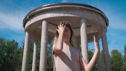 Teen Outdoors in Front of Column Structure