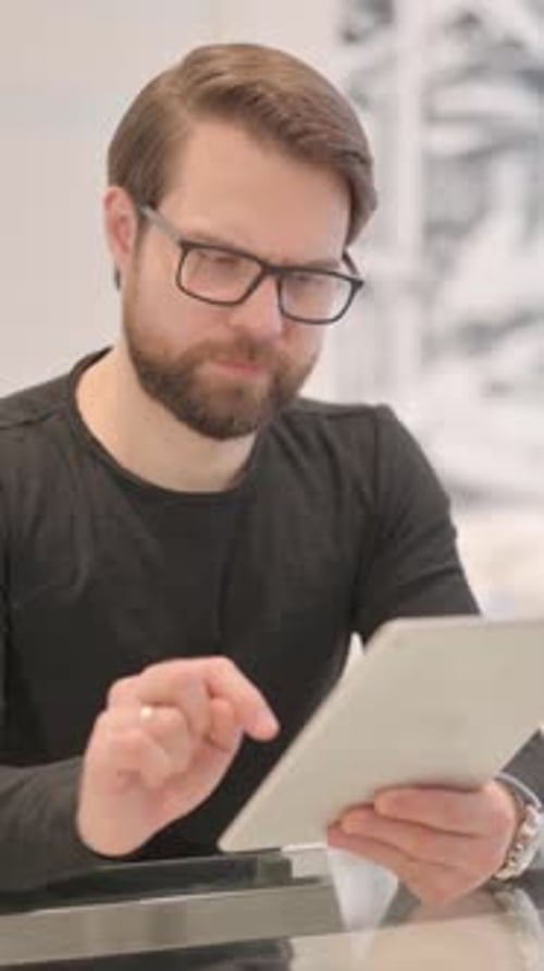 Man Using Tablet Device for Communication