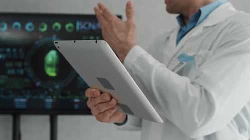 Medical Doctor Using Tablet in Modern Clinic