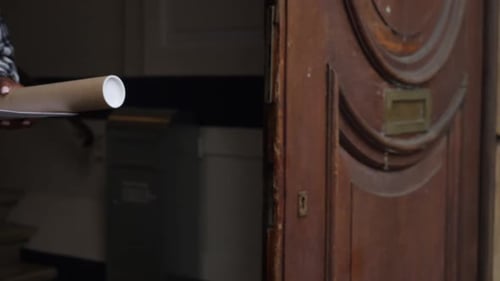 Passing Tube Package by a Wooden Door