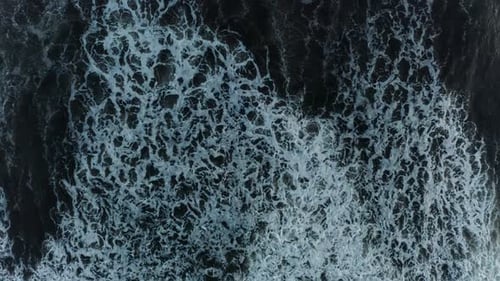 Waves and Foam in the Ocean View From Above Dark Water