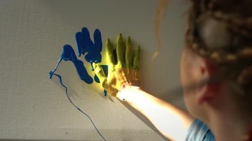 A Talented Girl Creates a Creative Picture with Her Hands and Fingers