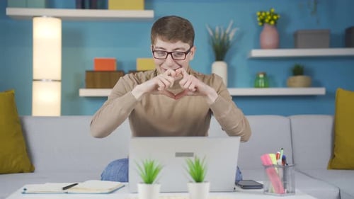 Cheerful Man on Video Call Waving and Smiling