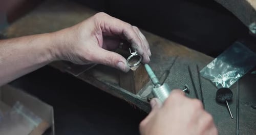 Jeweler Polishes a Ring During the Making Process in a Workshop