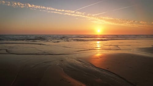 Atlantic Ocean Sunset with Surging Waves at Fonte Da Telha Beach Portugal