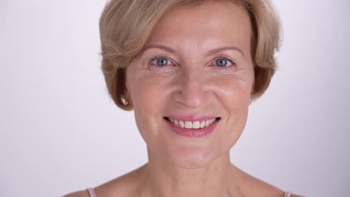Smiling Blonde Woman Posing in a Close Up Shot
