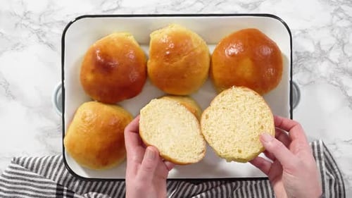 Golden Brown Rolls Being Split Open