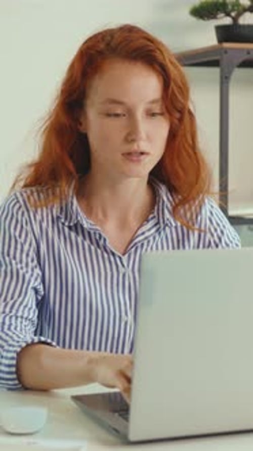 Woman Coughing While Working At Her Desk