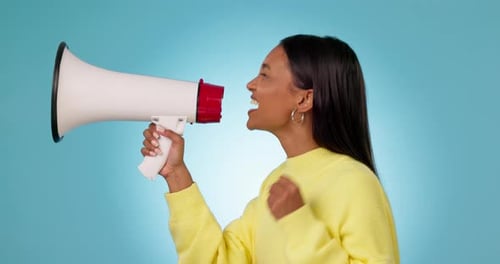 Profile, protest or woman shouting in studio on blue background for freedom on megaphone