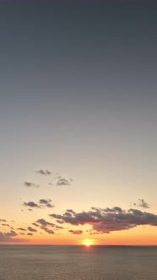 Timelapse Fluffy Cumulus Clouds Moving in Bright Golden Sunset Sky Over Sea Abstract Aerial Nature