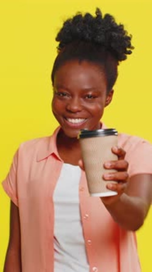 African American Woman Enjoying Drinking Morning Coffee Plastic Cup in Hand Satisfied Expression