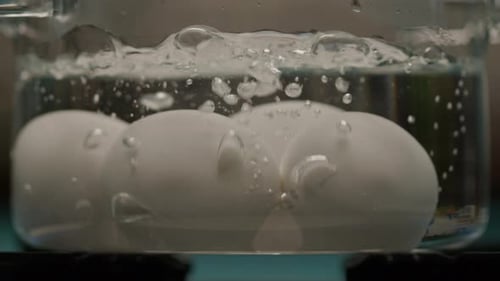 Eggs Boiling in Hot Water