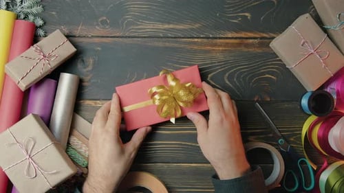 Gift Wrapper Man Hands Beautifully Gives It to Woman Top View Receiving Red Presents Congratulations