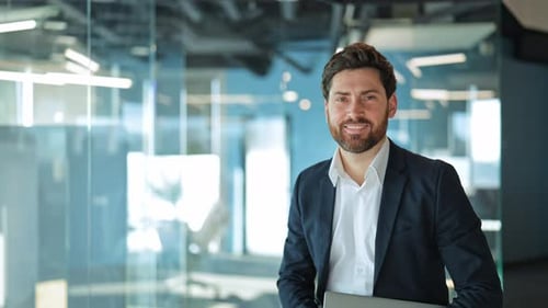 Successful Business Man Confidently Smiles in Modern Office