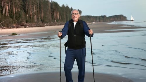 Sports 70s Elderly Man Posing with Walking Stick at Seaside Beach Relaxing Enjoy Healthy Lifestyle