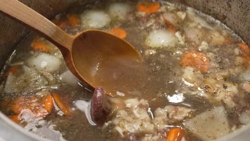 Simmering Homemade Bone Broth with Vegetables