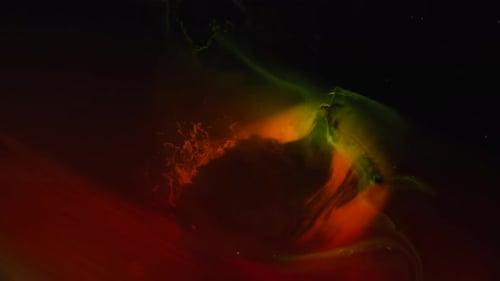 Abstract Liquid Colors Flowing in Dark Setting