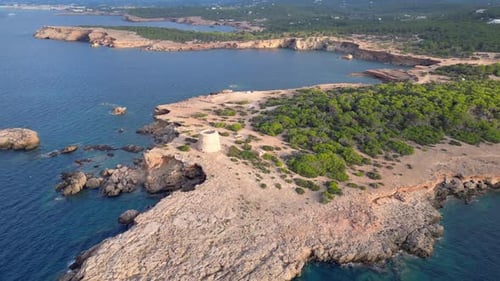 mediterranean coastal sunset ancient historic tower. Perfect aerial top view flight drone shot foota