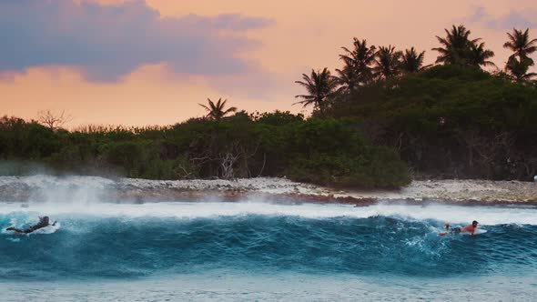 Back view of the ocean wave breaking on the shore in Maldives and ...