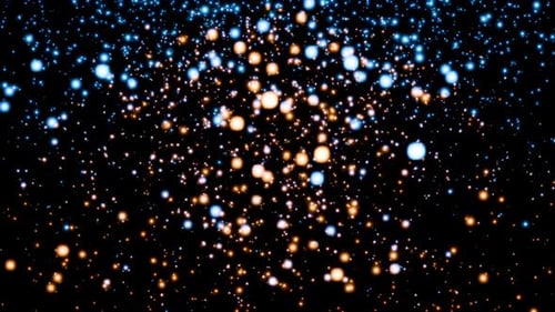 Continuous stream of cyan and golden particles endlessly fall and shimmer against a black