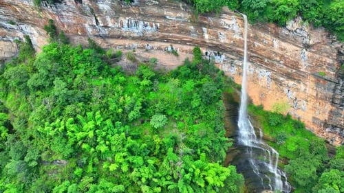 Aerial View of Green Cliffside Waterfalls