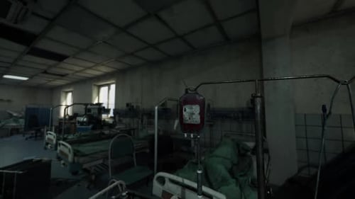 Abandoned Hospital Ward with Beds and Medical Equipment in Disrepair