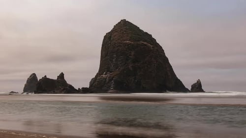 The famous landmark Haystack Rock in Cannon Beach at the Oregon Coast
